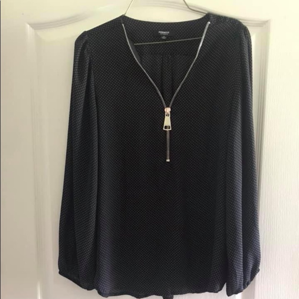 Black and whit polka dot blouse.